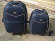 £8 - TROLLEY SUITCASES. 2 dark blue