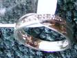 £25 - 9ct.White Gold 7 Diamonds Ring, 